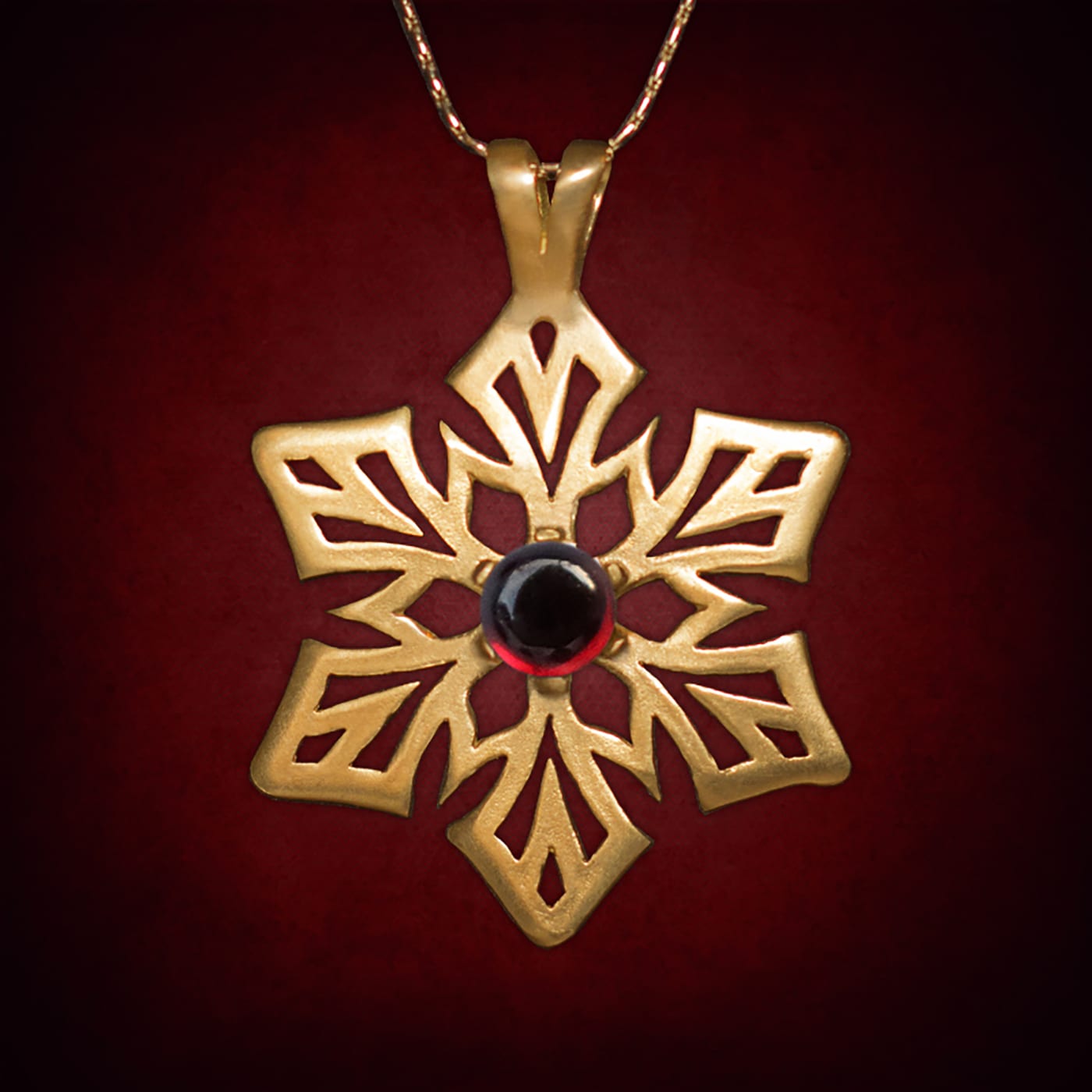 Astral Snowflake — Gold-Plated Silver · Garnet