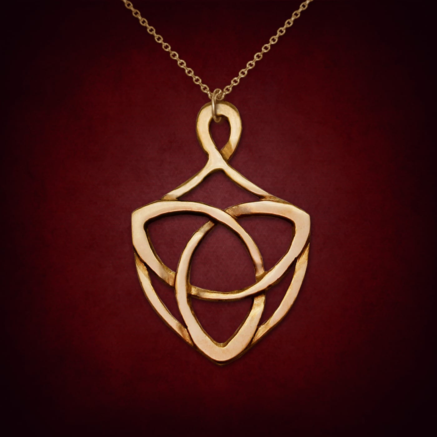 Trinity Shield — symbolic jewelry by Alumia